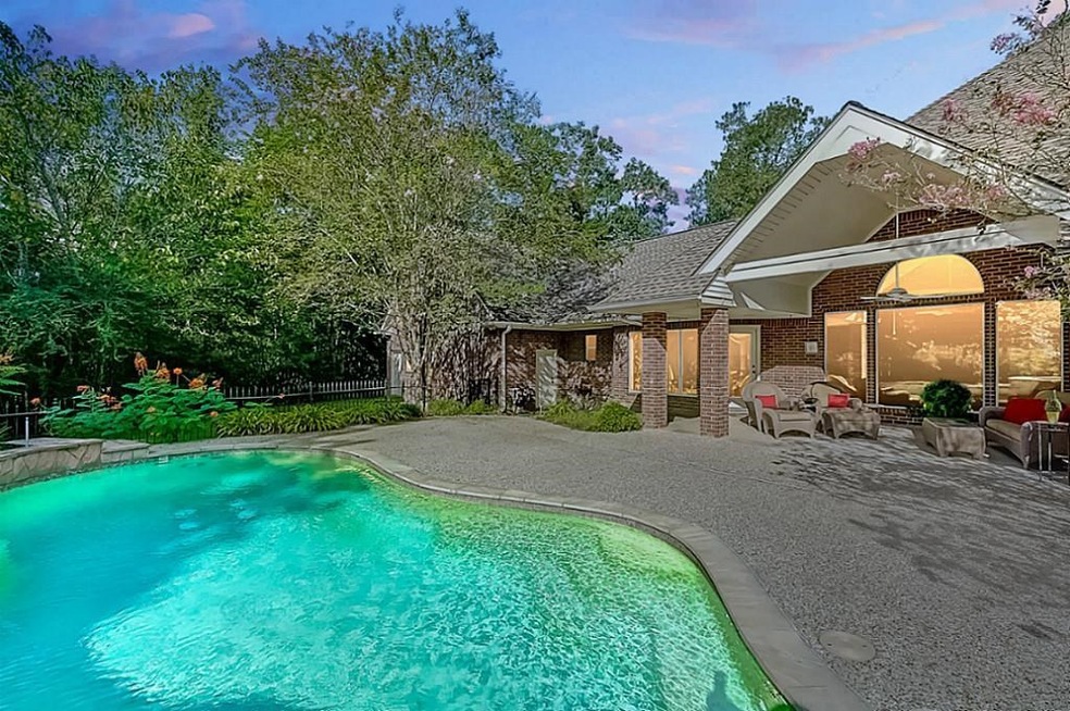 Inviting pool to cool off and enjoy your summer evenings.  Covered patio area, mosquito misting system and sprinkler system all surrounded by the natural wooded beauty of Teaswood