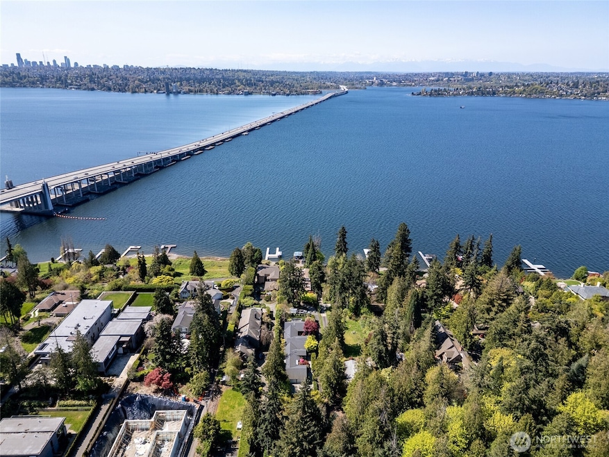 Nestled along the coveted Evergreen Point Road, this exceptional Medina property offers rare west-facing views of Lake Washington.