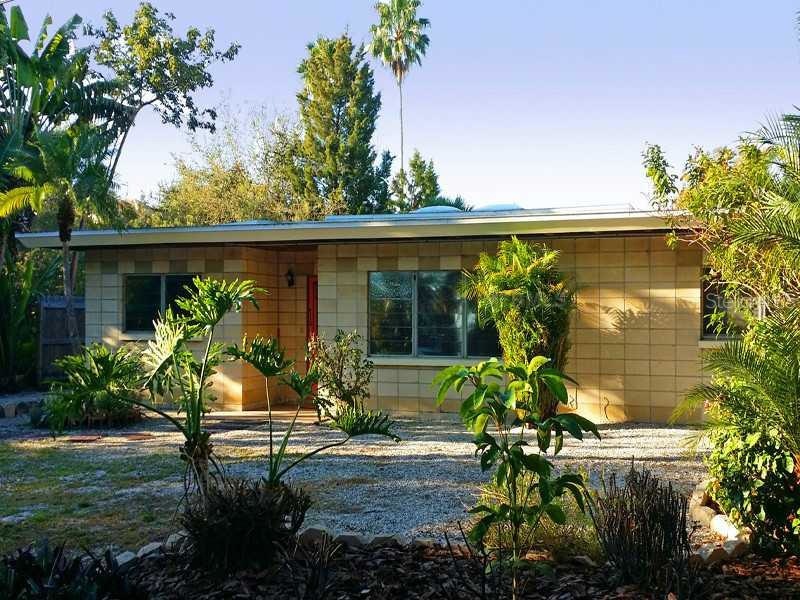 Exterior Front - Walk to the beach from this mid-c