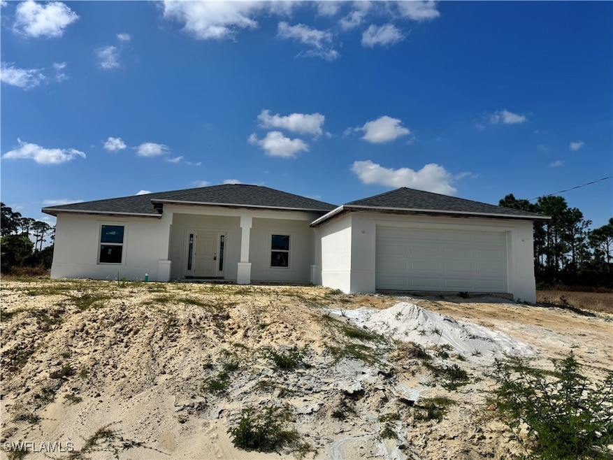 View of front facade featuring an attached garage