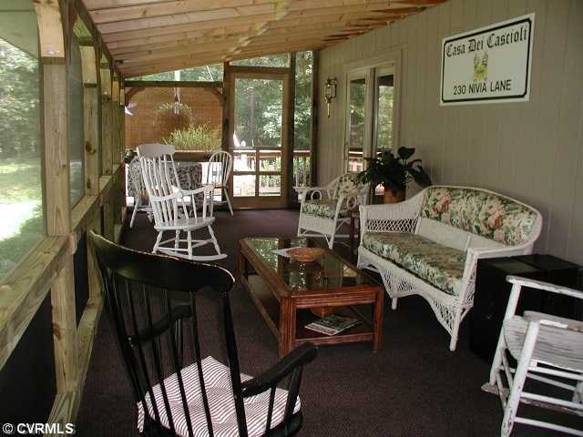 Exterior Front - relaxing screened porch with wate