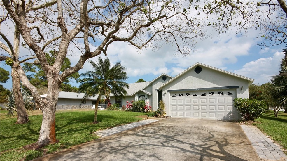Front view with enlarged driveway for more parking