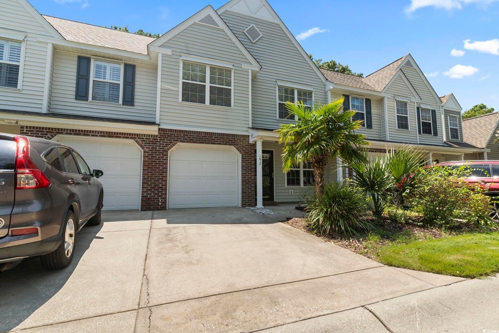 View of property with a garage
