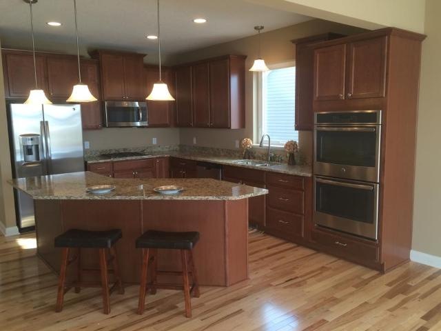Signature kitchen with double wall ovens and gas c