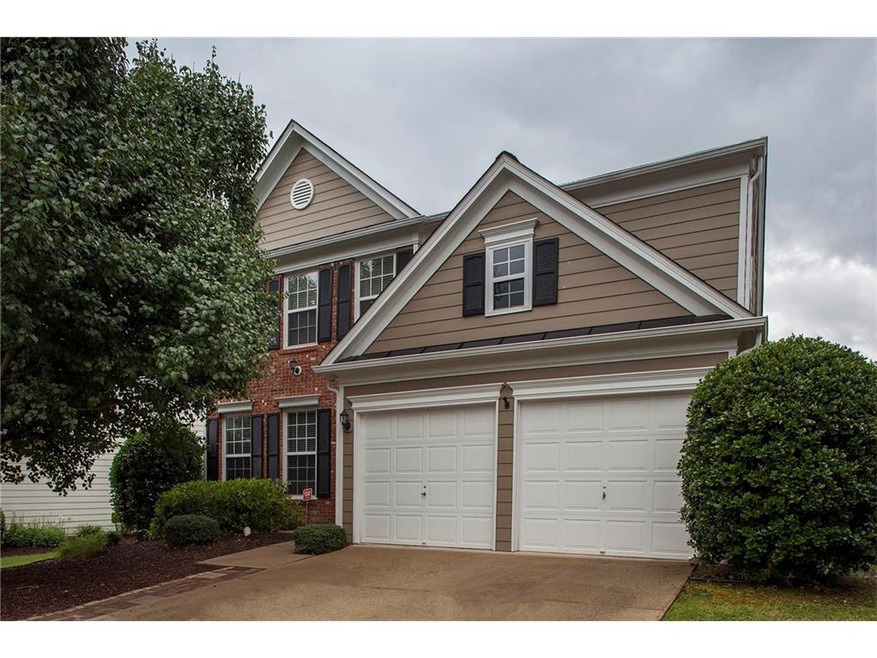 Classic traditional home with brick and cement sid