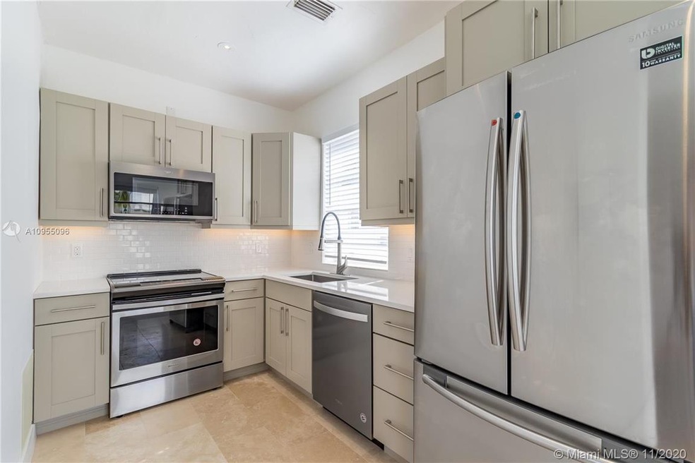 Updated kitchen with stainless steel appliances an