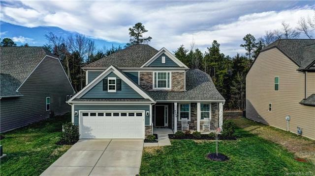 Beautiful stone front with cozy front porch.