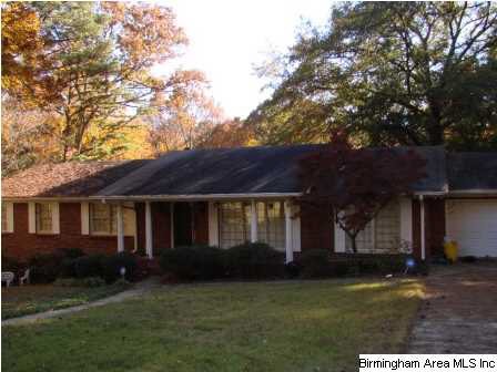 Front view, with driveways on right and left of ho