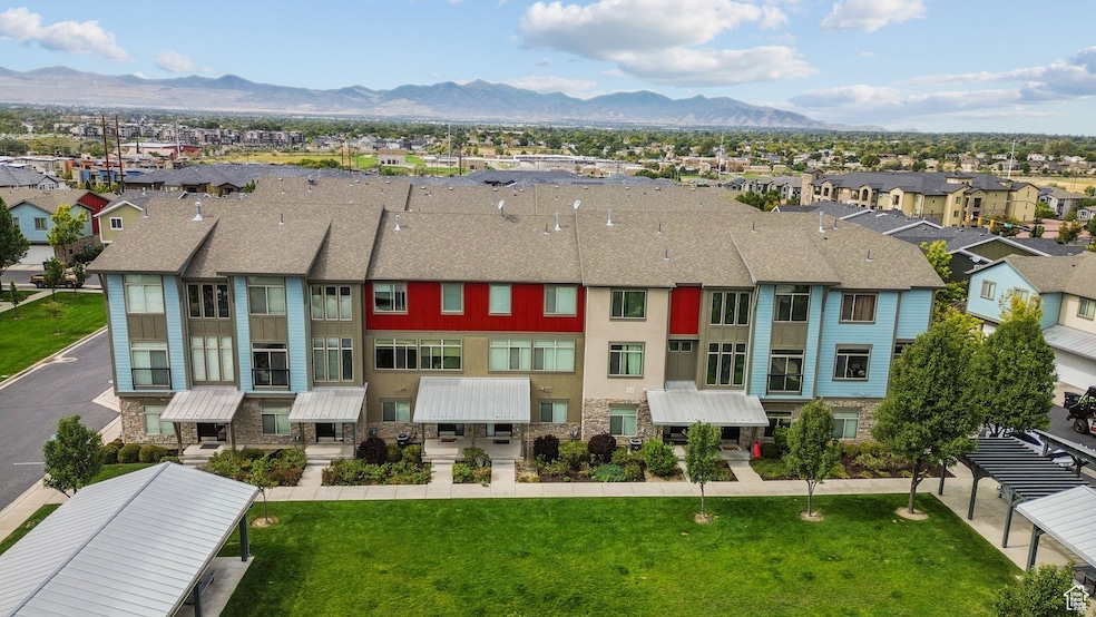 Aerial perspective of suburban area featuring a mountain backdrop