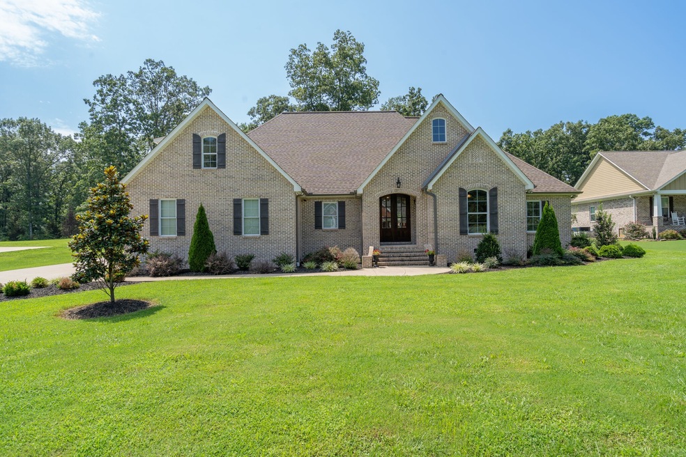 Welcome to your dream home! This nearly perfect home is nestled in a gorgeous neighborhood with mature trees, offering a serene and tranquil atmosphere. Situated on almost 1 acre of land, this property provides ample privacy and space.