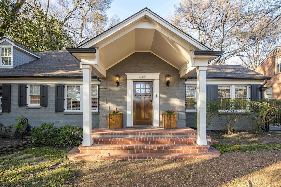Property entrance featuring a shingled roof and br