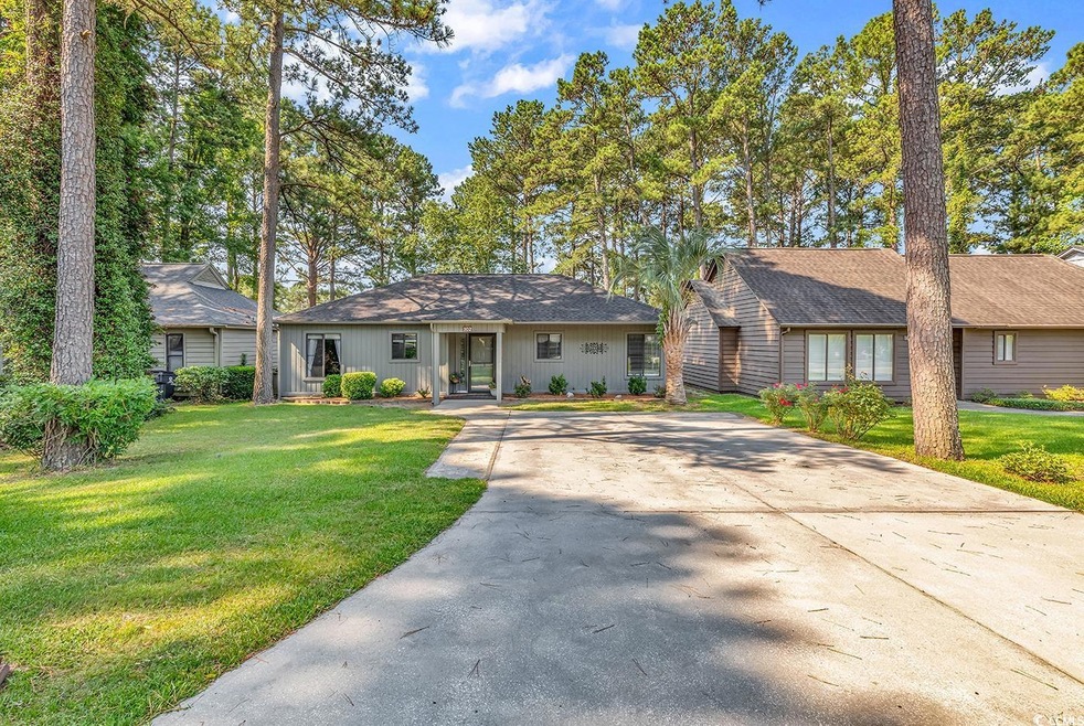 Single story home with a front lawn