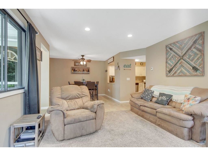 Bright  open living room connected to dining area 