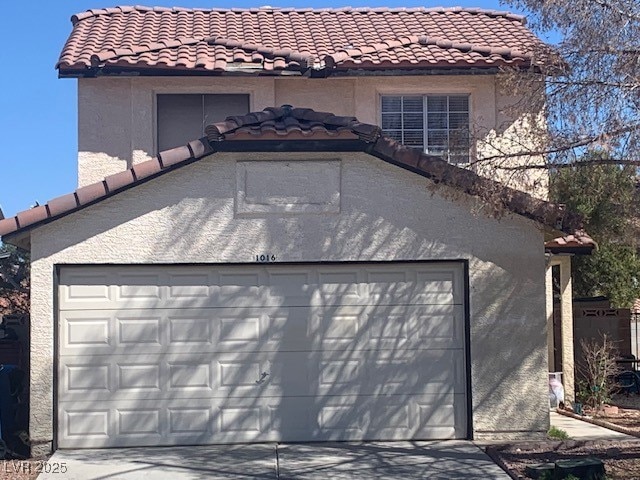 Garage featuring driveway