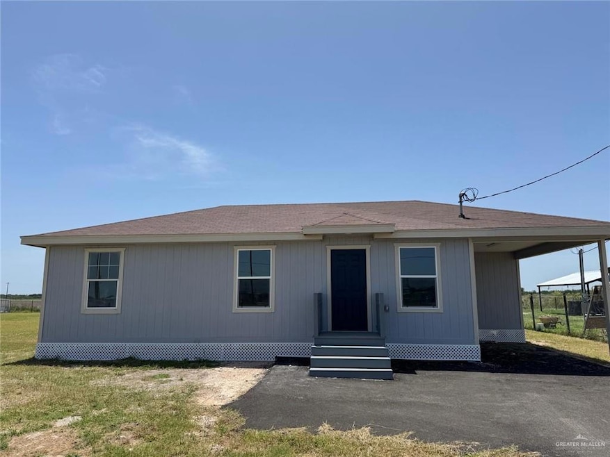 Manufactured / mobile home featuring entry steps and roof with shingles