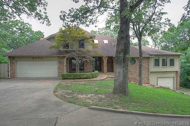 Exceptional two story located in stunning wooded s