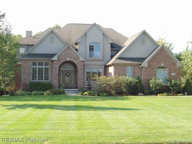 Beautiful curb appeal with brick detail, landscapi