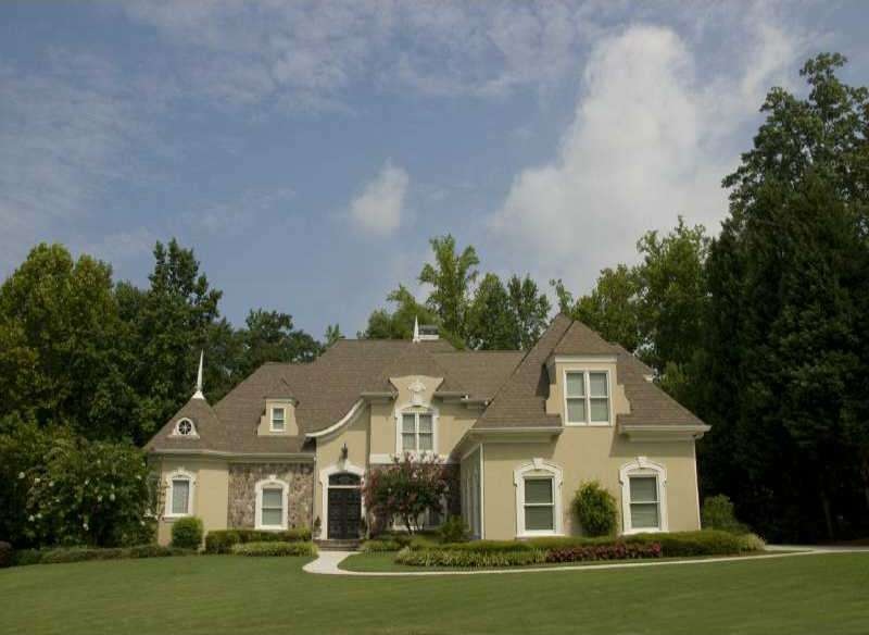 Exterior Front. Hardcoat and Stone Executive Home 