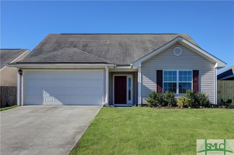 Great curb appeal with winter grass, flowers, and 