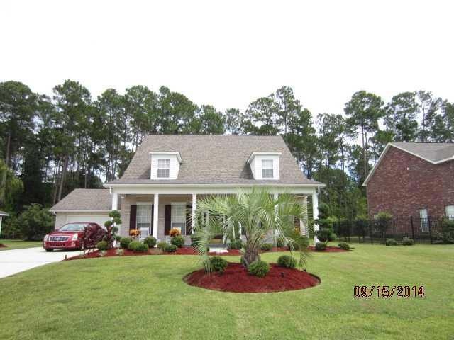 Facade/Exterior Front. Beautiful landscaping