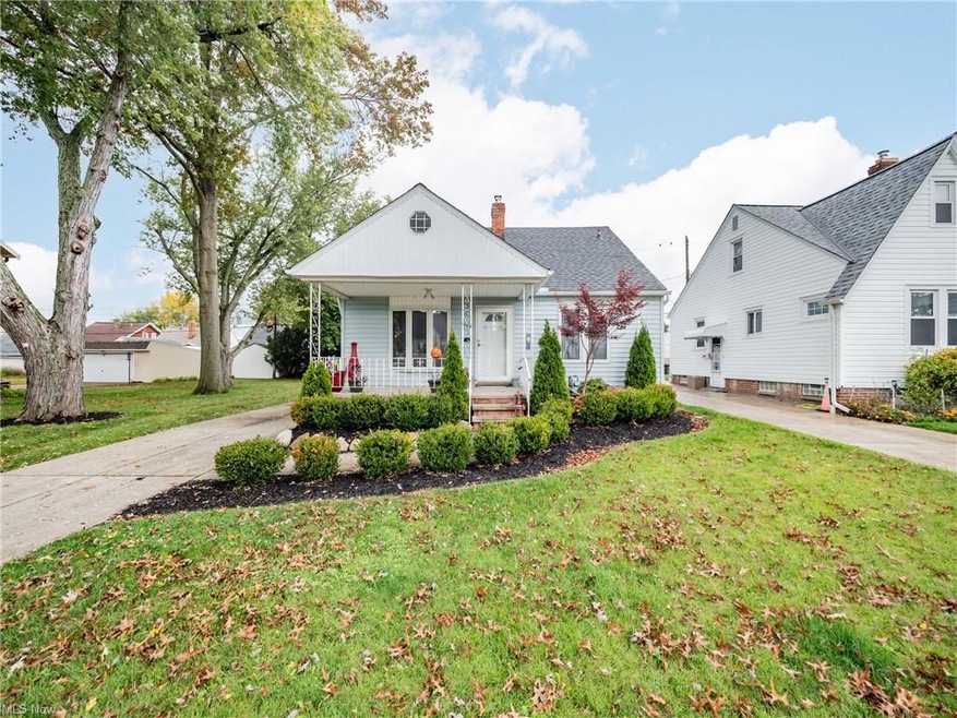 View of front of house featuring a porch and a front lawn