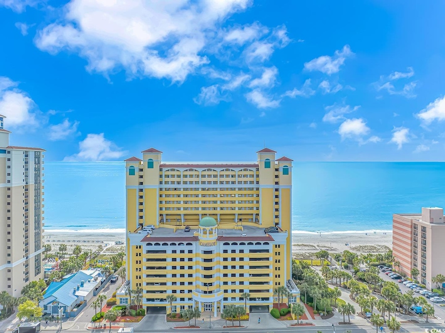 Exterior space with a view of the beach and a wate