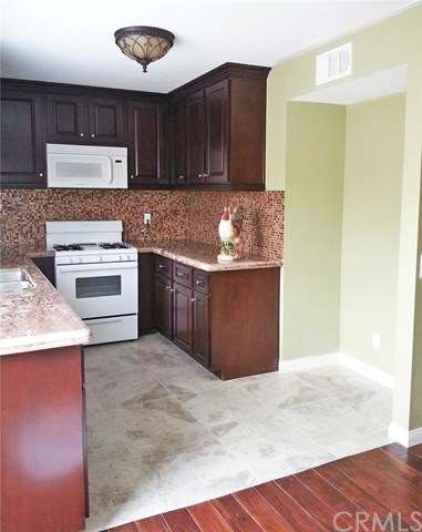 Cherry wood cabinetry, granite counter tops, tile 