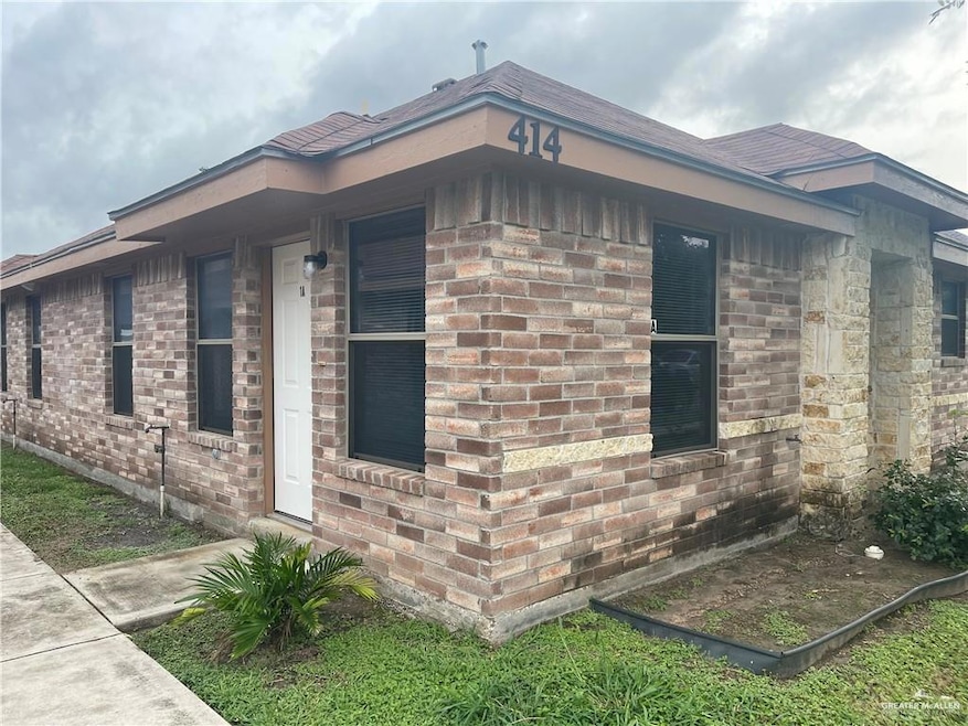 View of side of home featuring brick siding