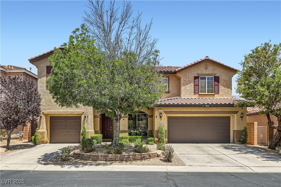 Mediterranean / spanish home featuring driveway, a