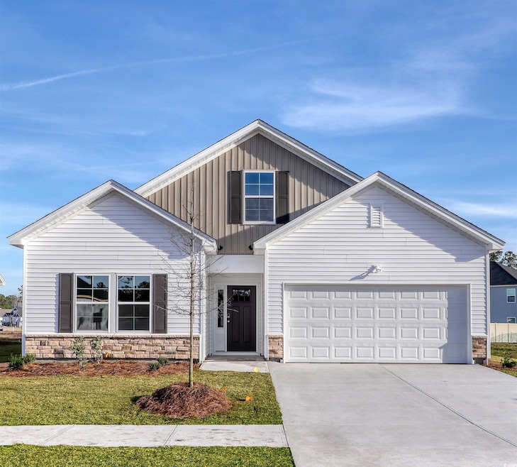 View of front of property featuring a garage and a