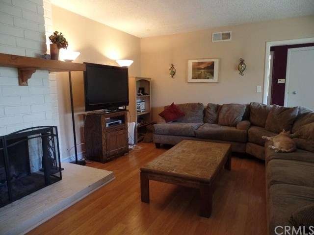 Spacious Living Room with Fireplace and large wind