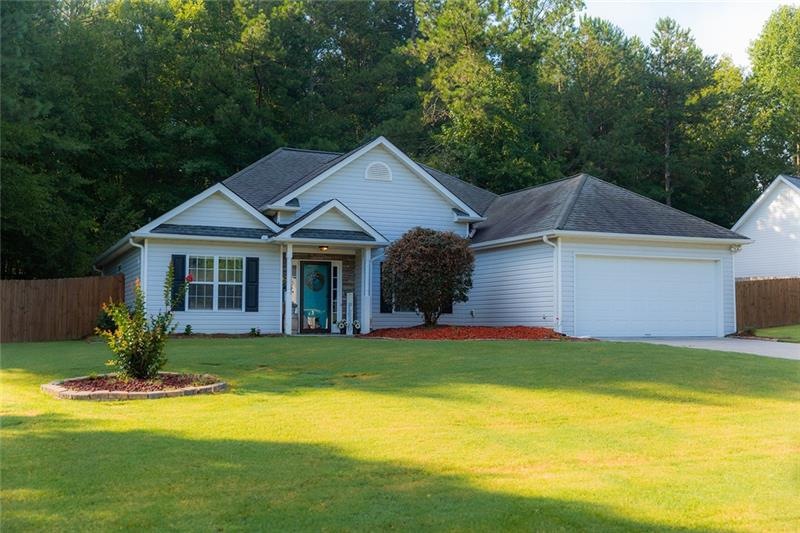 Beautiful front of home w/ lovely yard & great cur