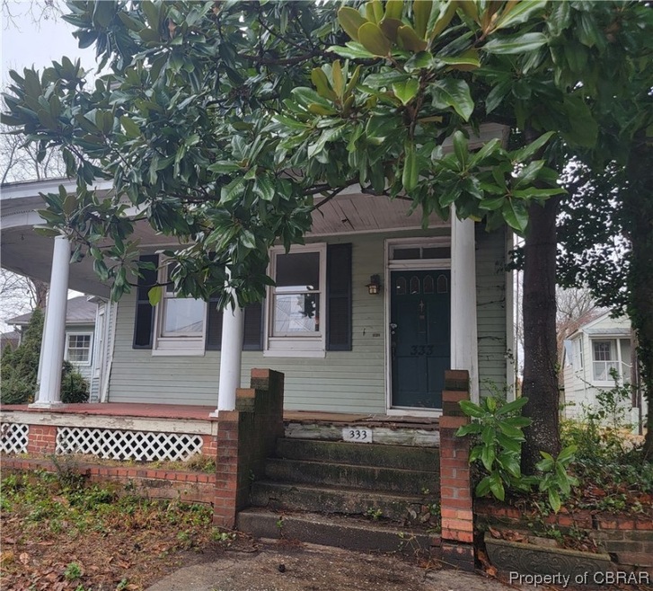View of front of home featuring covered porch