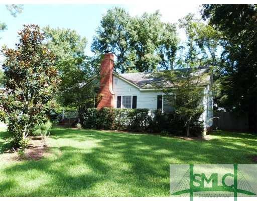 Exterior Front. Large landscaped front yard - walk