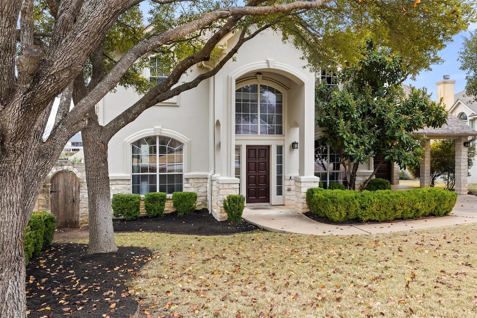View of exterior entry featuring stone siding, a 
