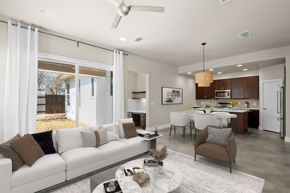 Living room with recessed lighting, visible vents