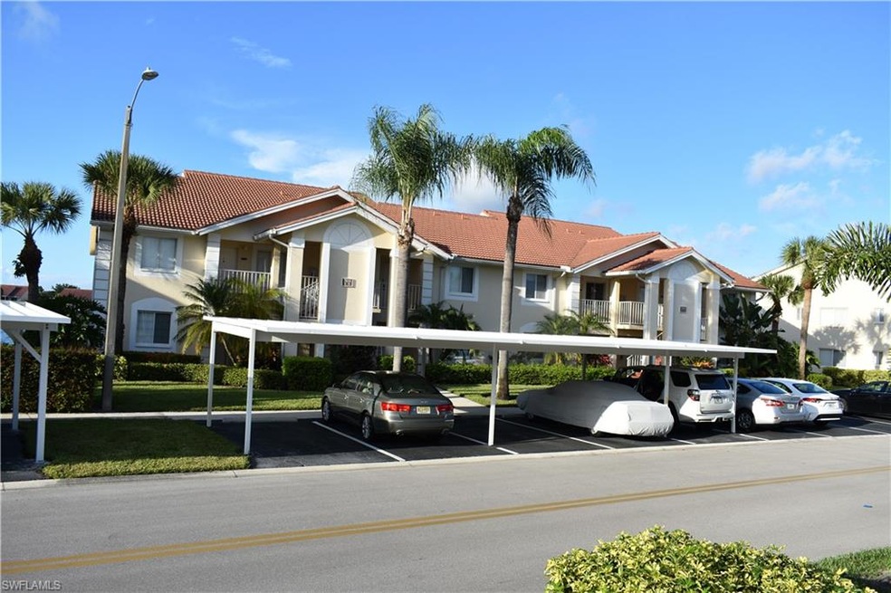 Front View with Carport Far Right End Spot