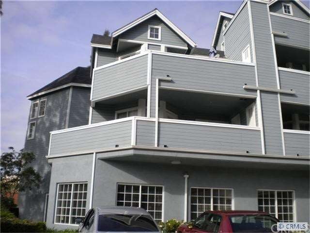 Unit #101 with wrap-around Balcony
