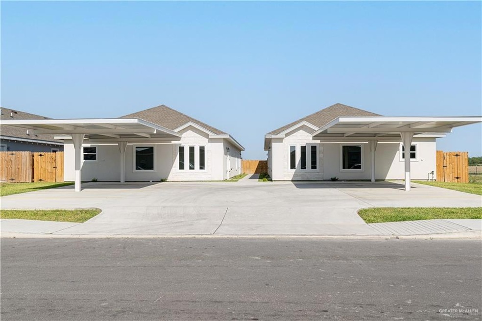Ranch-style home featuring fence