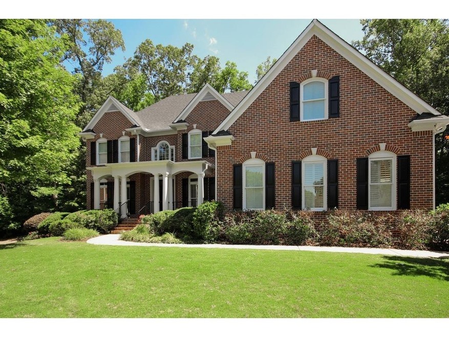This spectacular brick estate home with a three ca