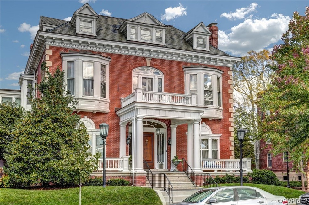 1908 Colonial Revival design by architect William C. West with an exuberant facade.