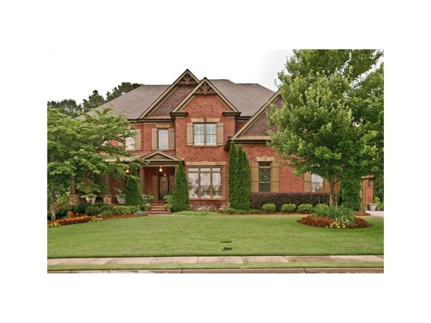 Exterior Front. 4 sides brick - 3 car garage - cul