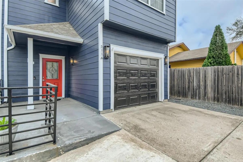Entrance to property with an attached garage