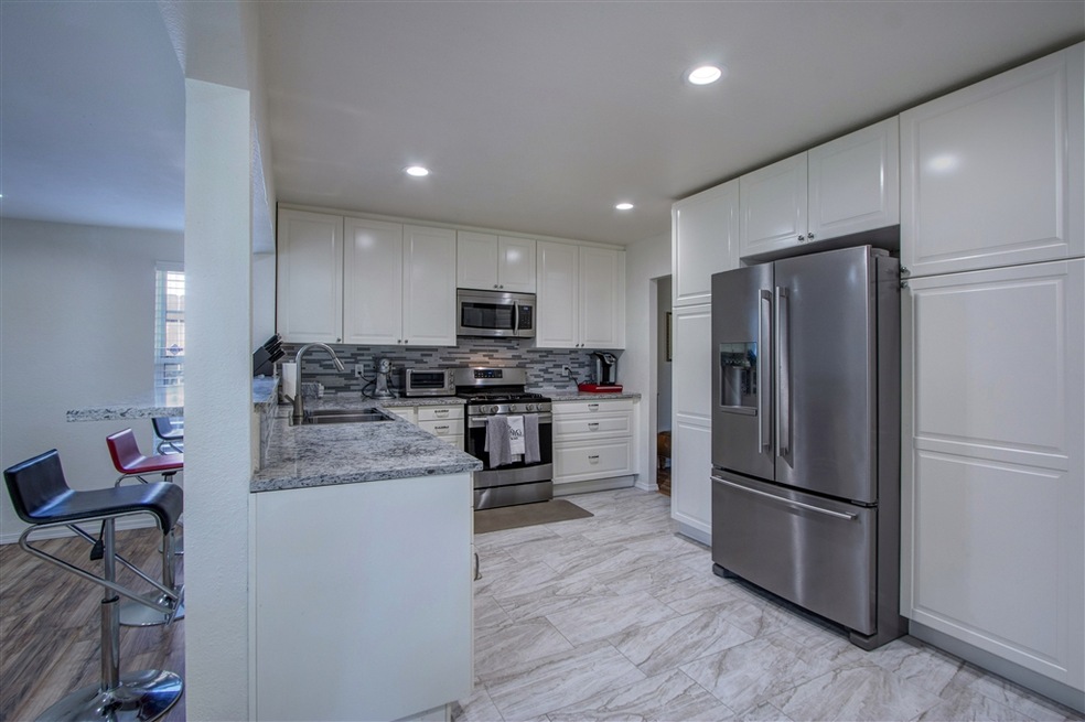 Remodeled with quartz counters, ceramic tile, desi