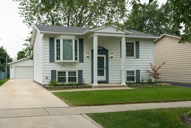 Great curb appeal, concrete driveway to oversized 
