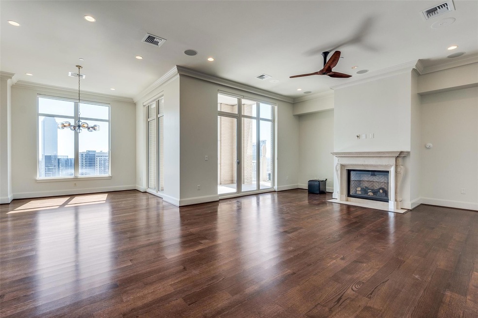 Unfurnished living room with ornamental molding, a