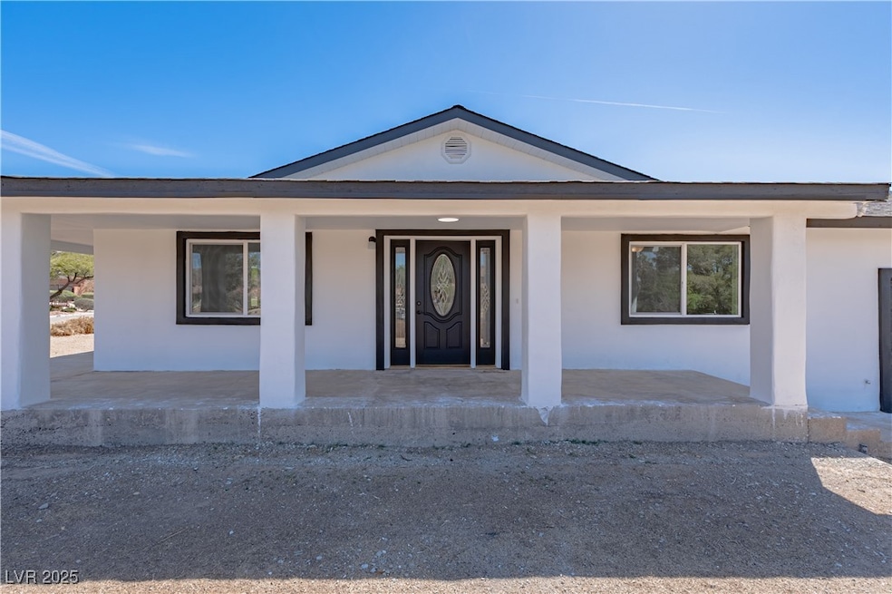 Doorway to property featuring stucco siding and co