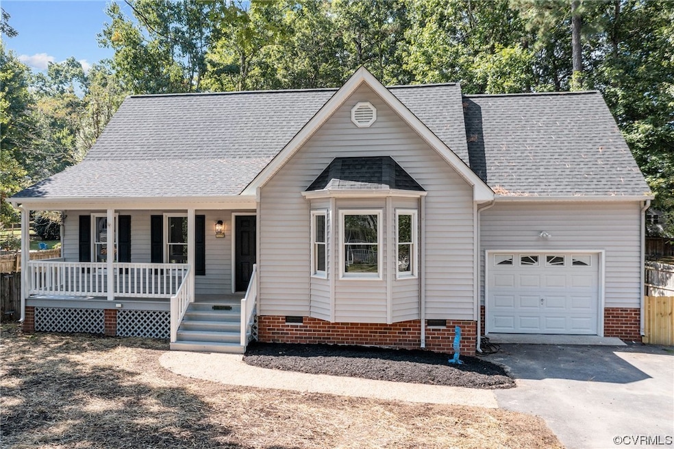 View of front facade with garage and a porch