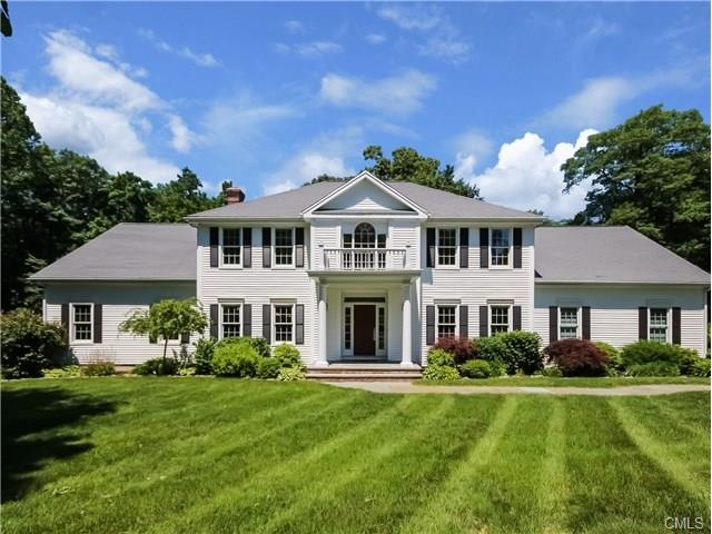 Classic Colonial on level 1 acre lot