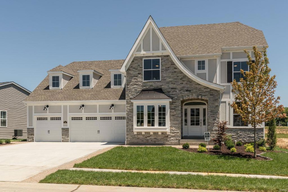 Gorgeous Front Elevation with Stone Facade and Five Car Garage (3 car front and 2 car tandem)